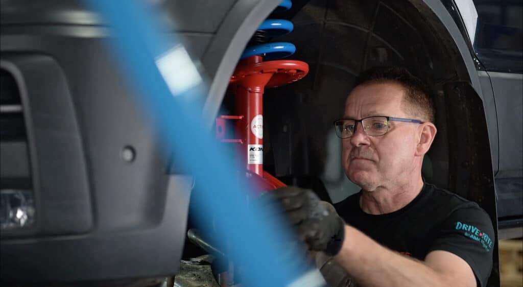 Glide-Rite mechanical engineer installing KONI system on a vehicle