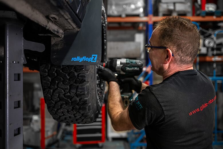 Glide-Rite's engineer working on a vehicle