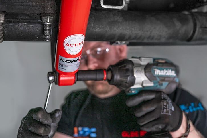Glide-Rite's engineer installing the KONI Special ACTIVE Shock Absorbers